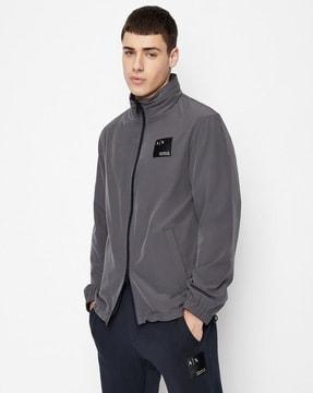 reversible jacket with jacquard logo patch