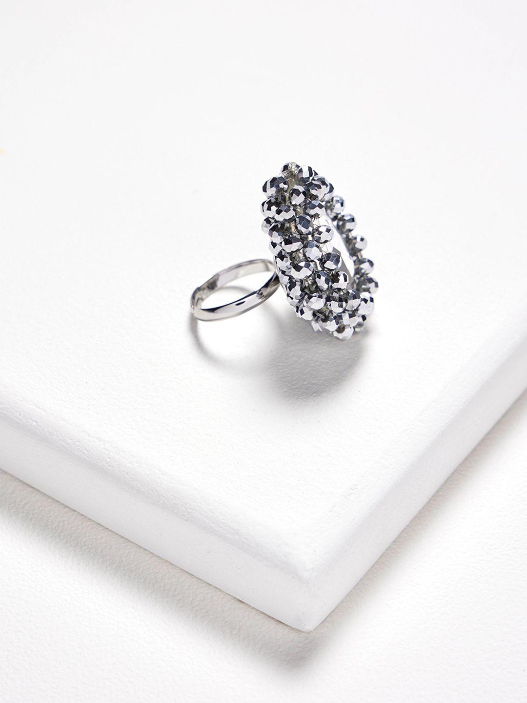 rhea rhodium plated crystal studded statement finger ring