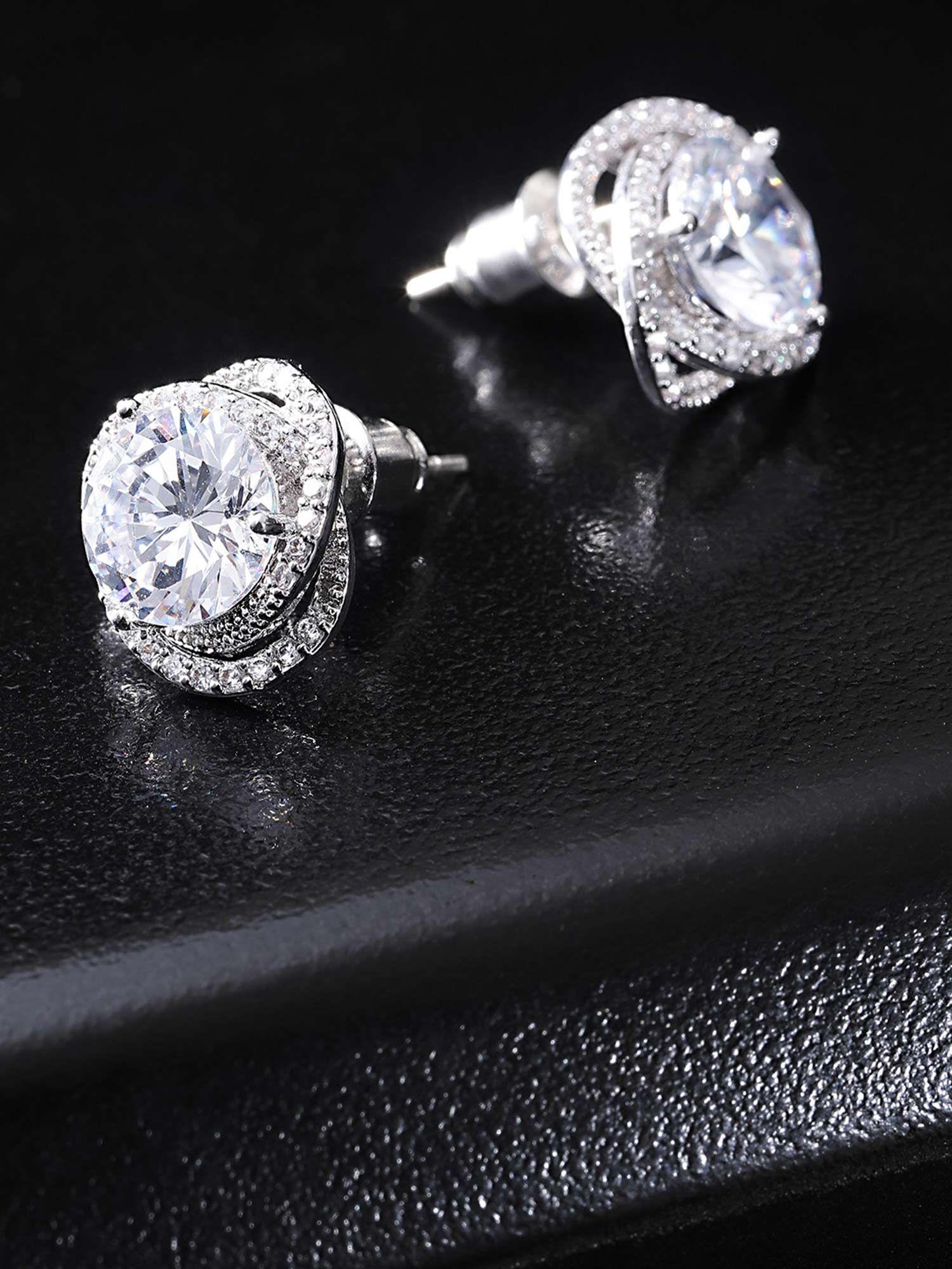 rhodium plated silver toned floral studs