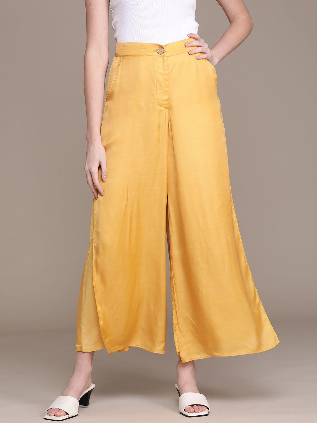 ritu kumar women mustard yellow solid satin flared high-rise trousers