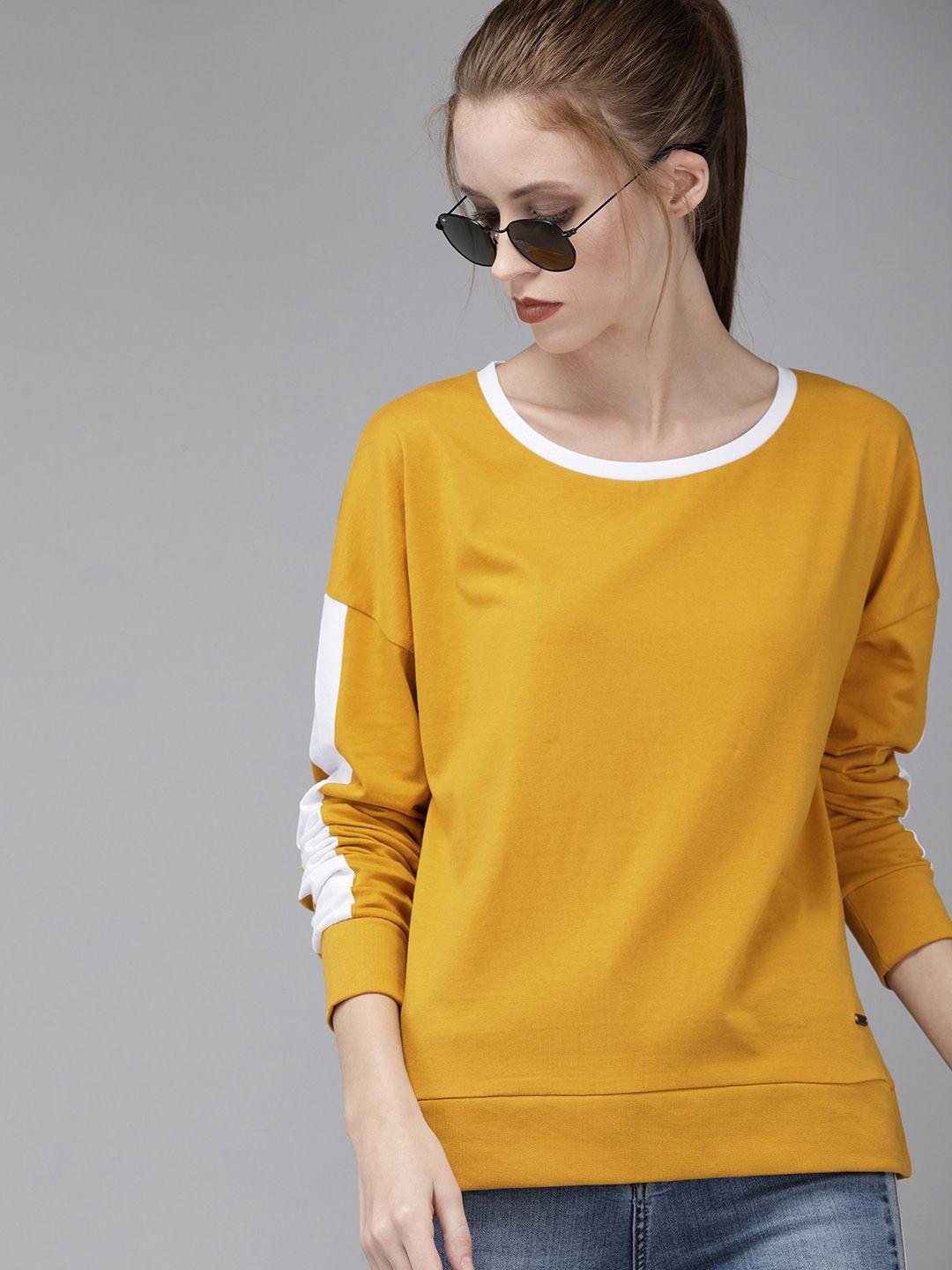 roadster women mustard yellow solid round neck pure cotton t-shirt with striped detailing