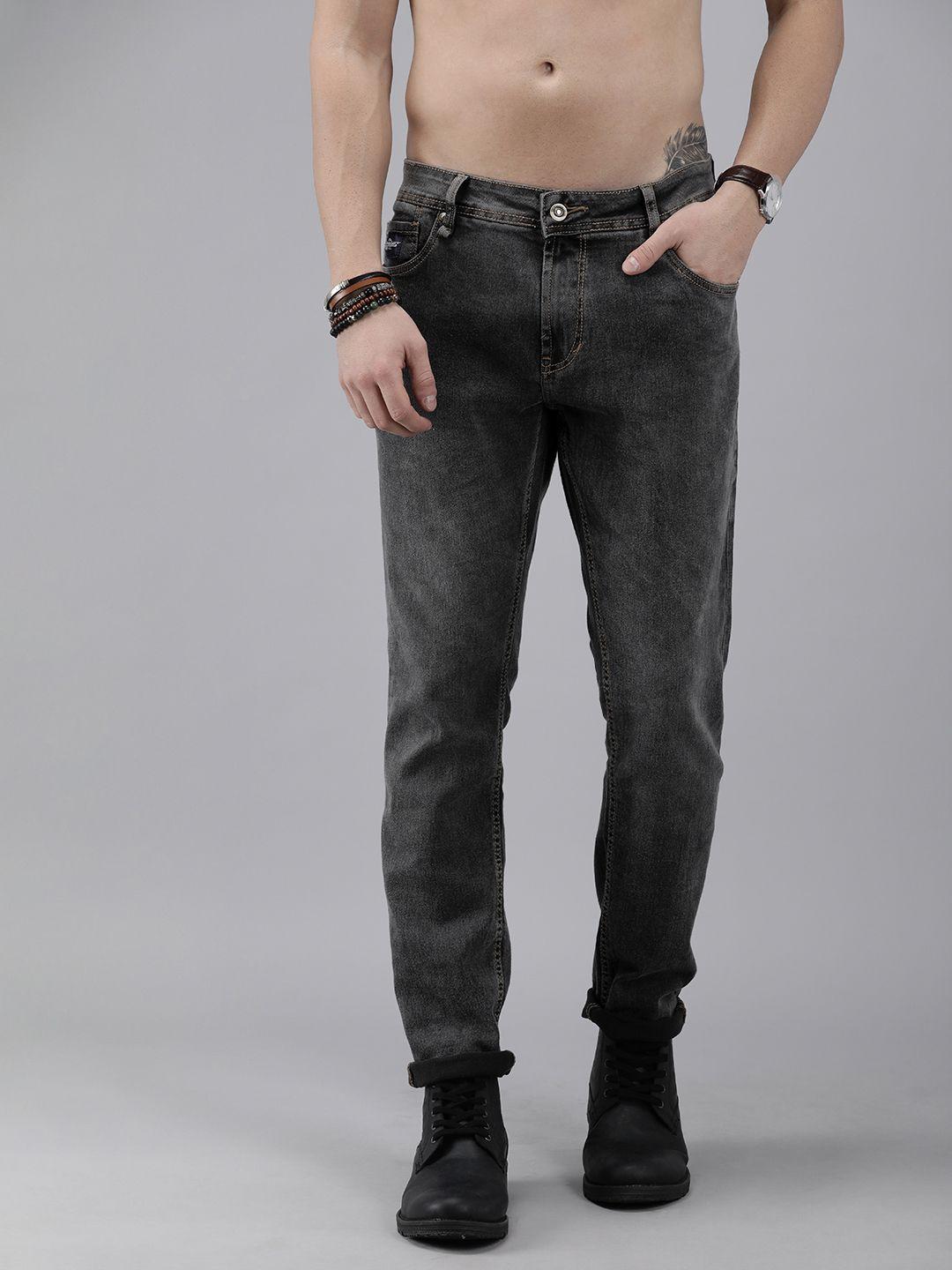 roadster men black carrot fit mid rise  light fade stretchable jeans