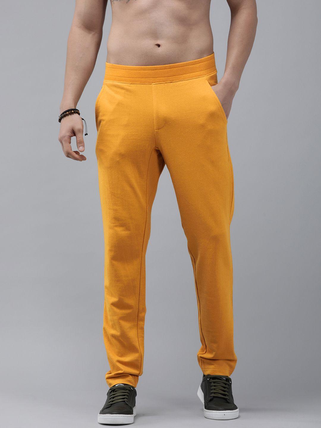 roadster men mustard yellow solid track pants