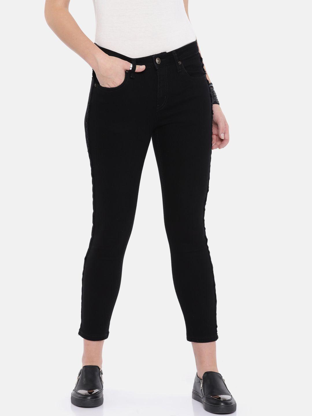 roadster women black skinny fit raw side seam cropped jeans