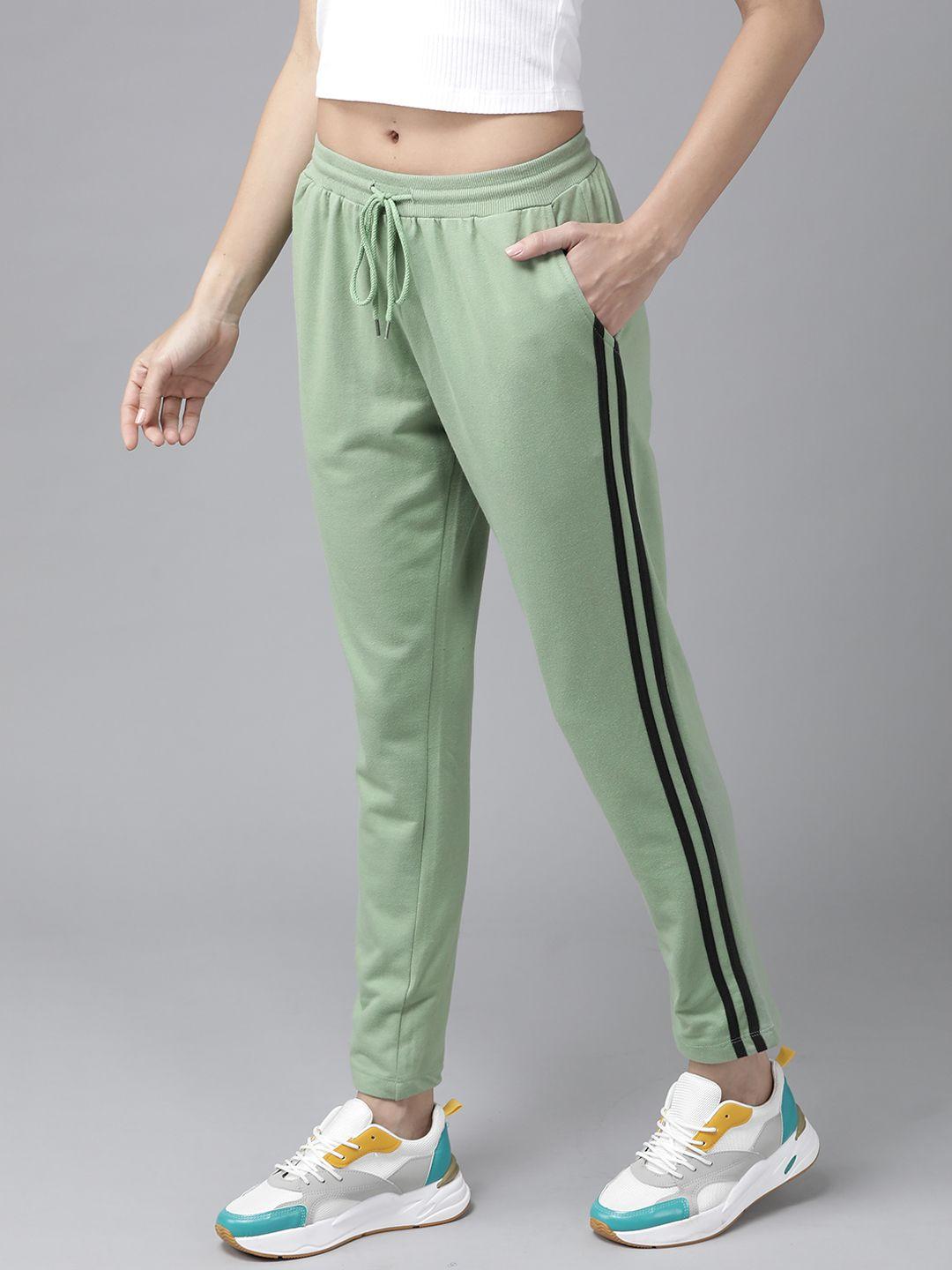 roadster women green solid cropped track pants with side stripes