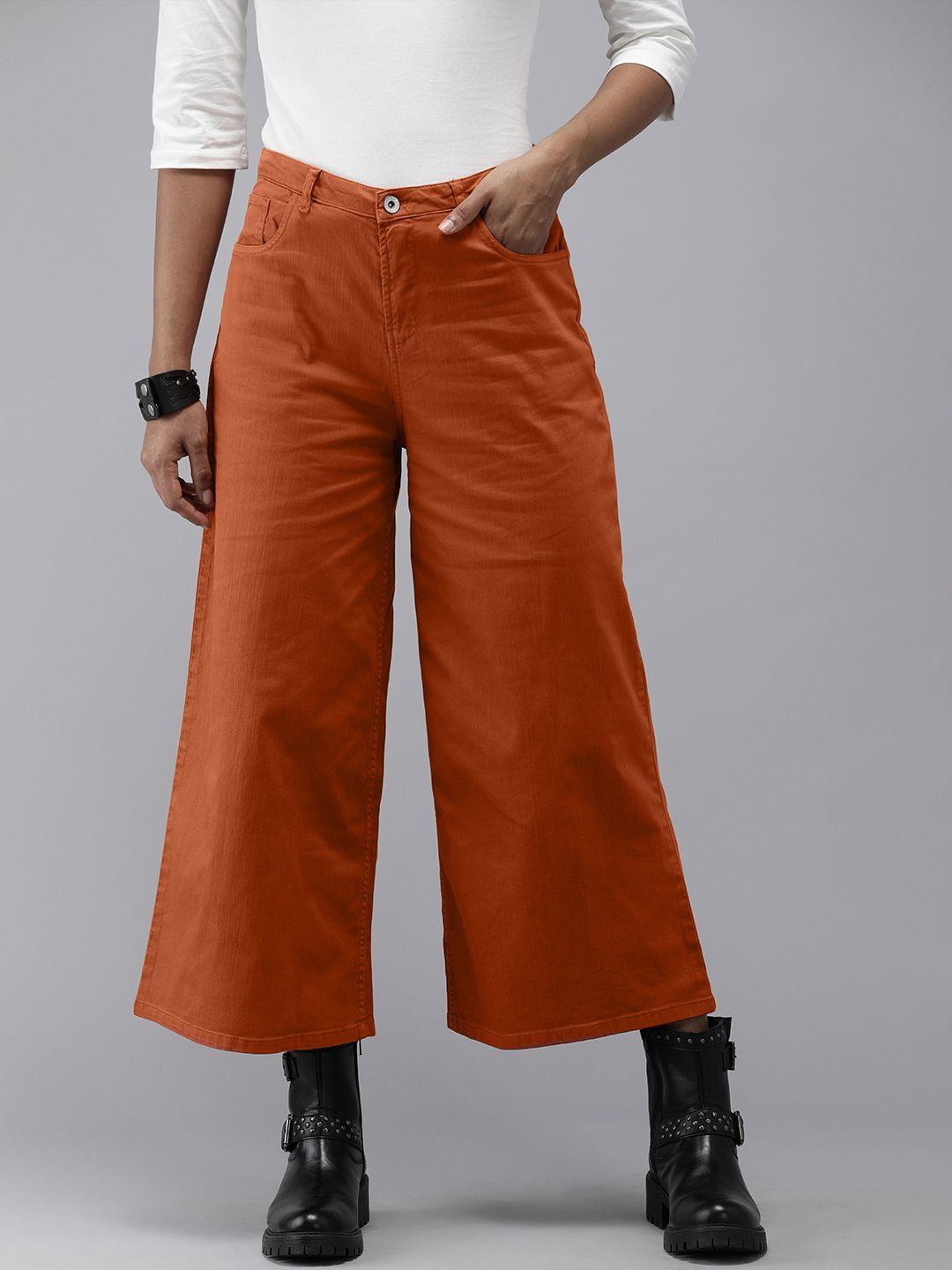 roadster women rust solid mid rise flared trousers