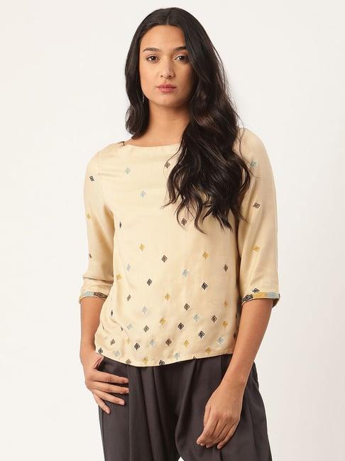 rooted beige embroidered top