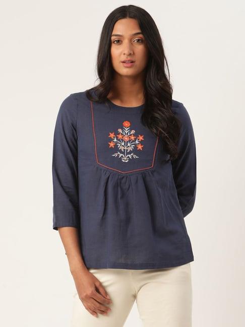 rooted blue embroidered top