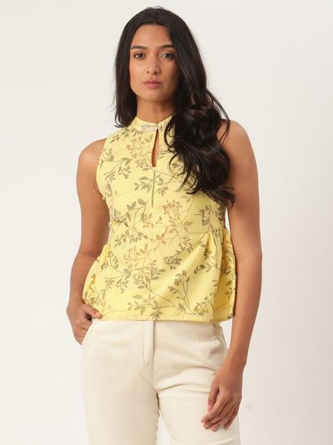 rooted yellow printed top