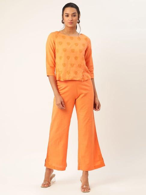 rooted orange embroidered top