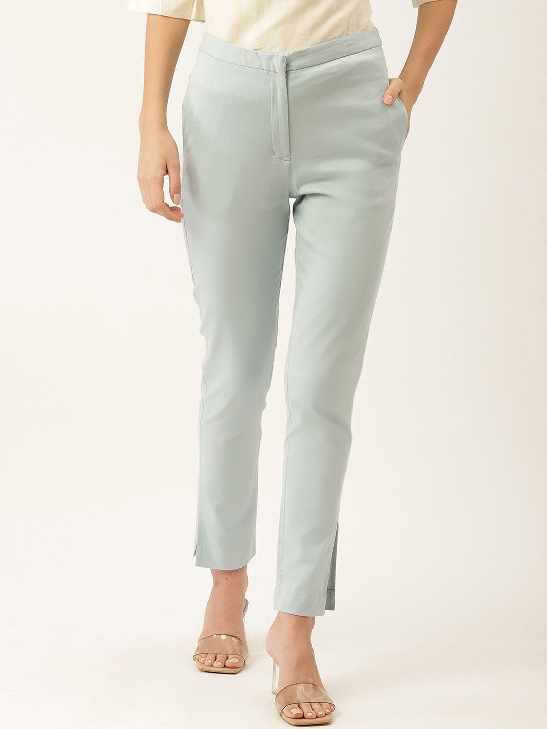 rooted women blue trousers