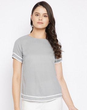 round-neck top with embroidered accent