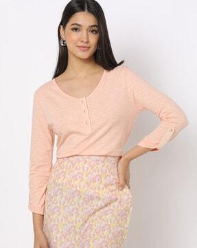 round neck top with roll-up sleeves