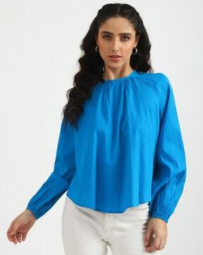 round-neck top with ruffle accent