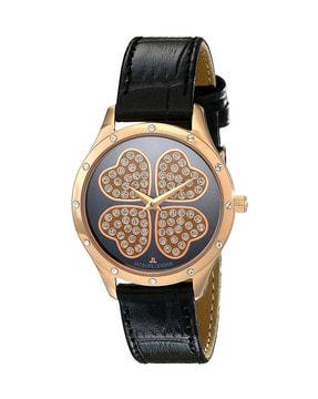 round shaped stone-studded analogue watch