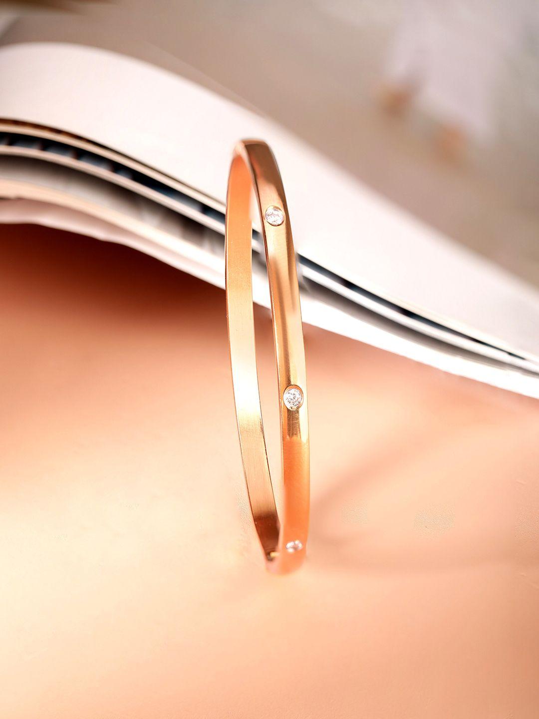 rubans voguish women gold-toned & gunmetal-toned brass handcrafted rose gold-plated bangle-style bracelet