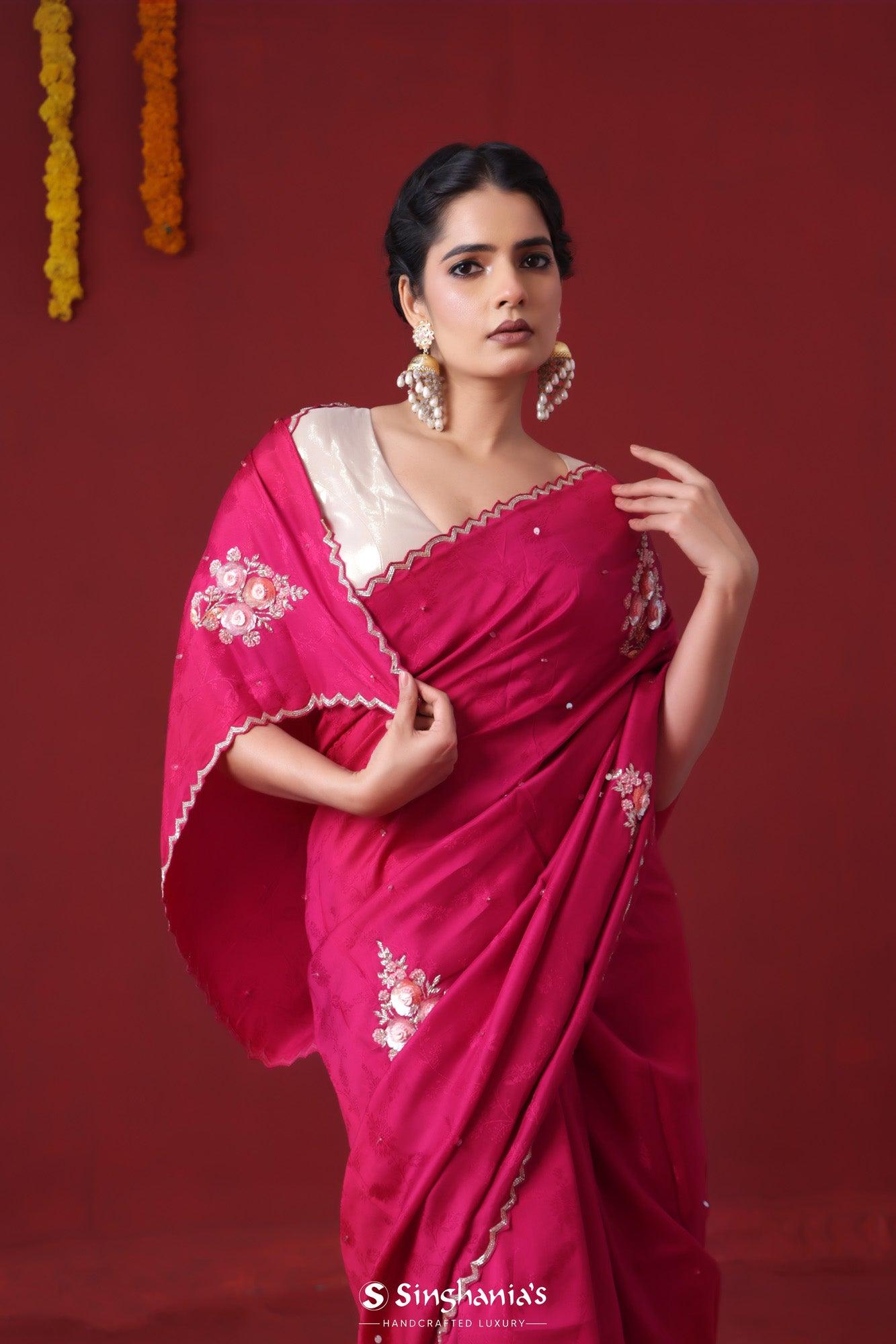 ruby pink handwork satin saree with floral butta