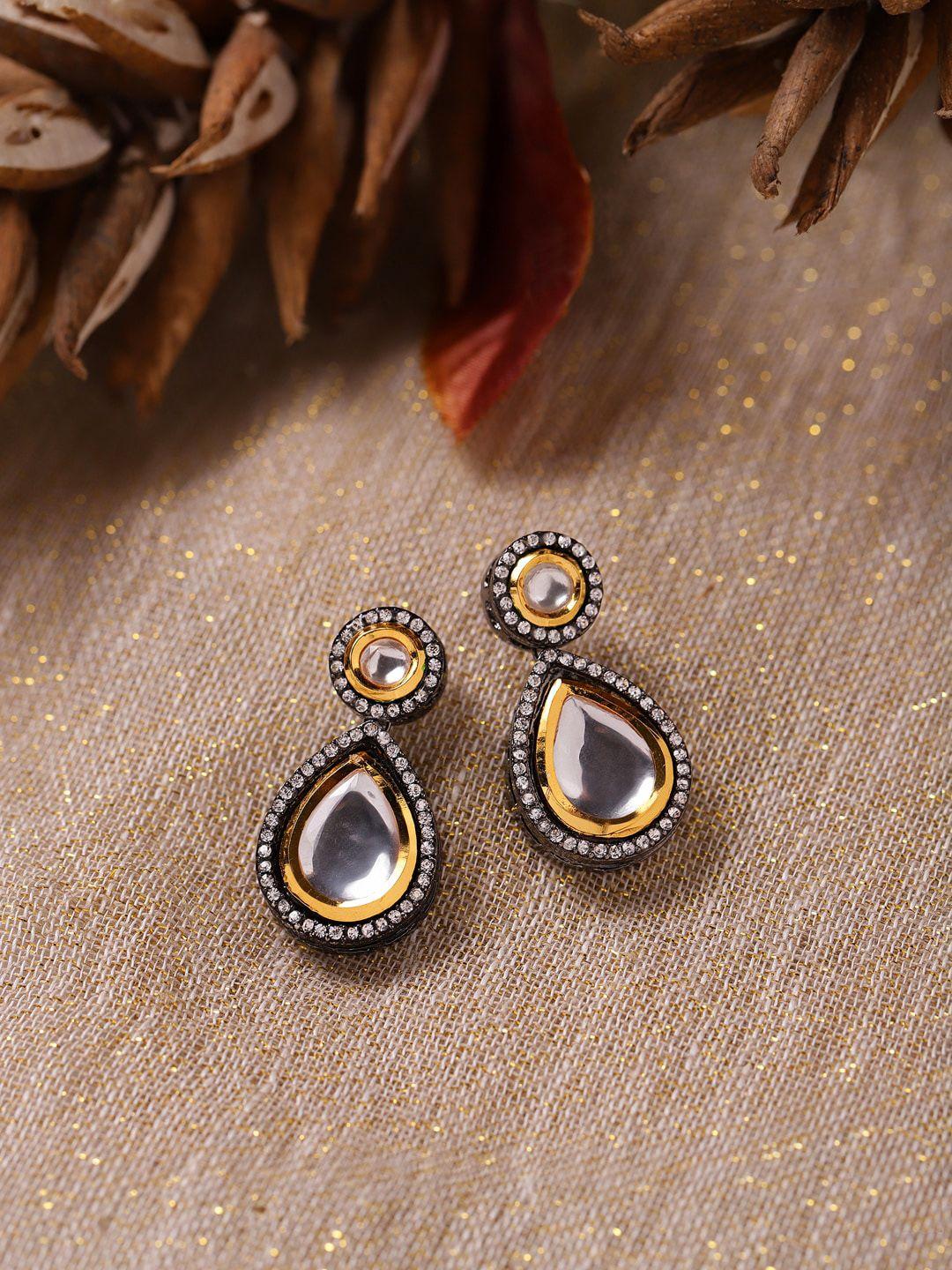 ruby raang silver-plated teardrop shape kundan studded drop earrings