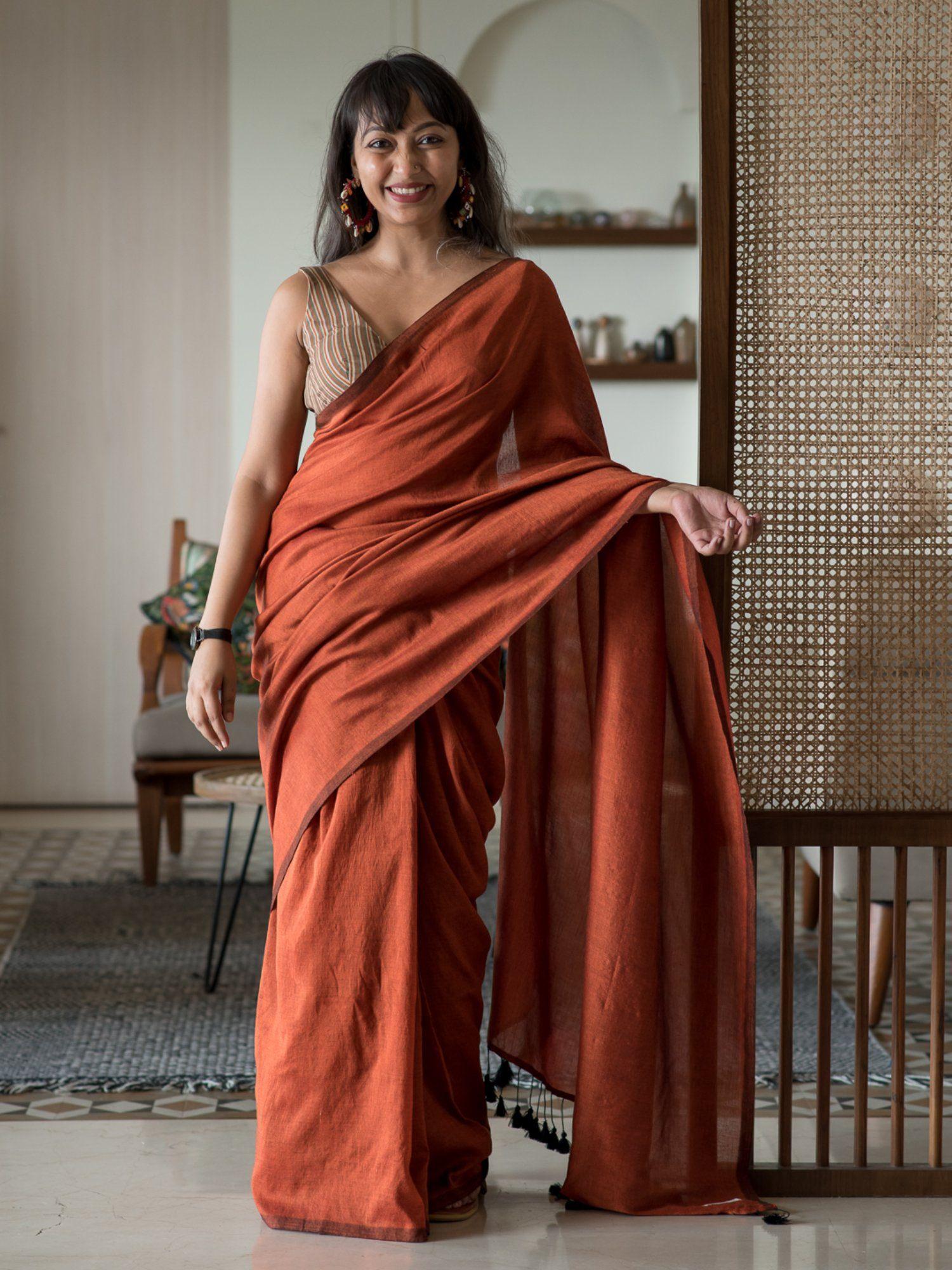 rust solid cotton blend saree without blouse