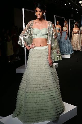 sage green ruffled lehenga with embroidered cape and corset