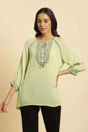 sage green top with embroidered yoke