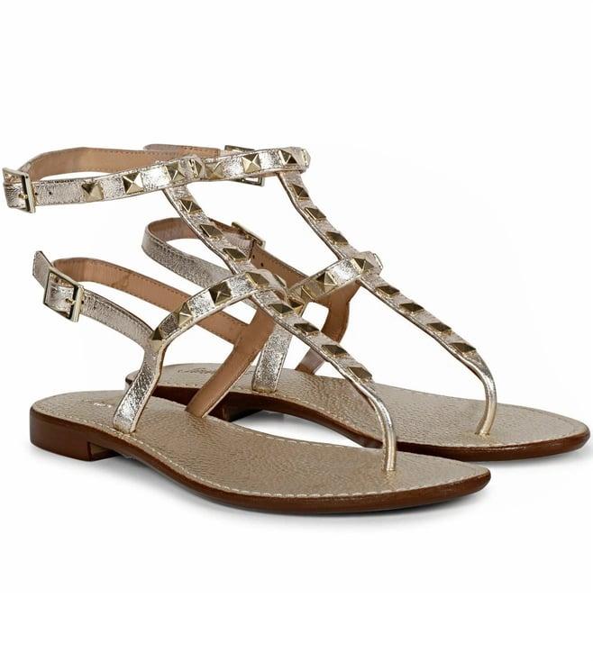 saint g irene platin leather metal studded flat sandals.