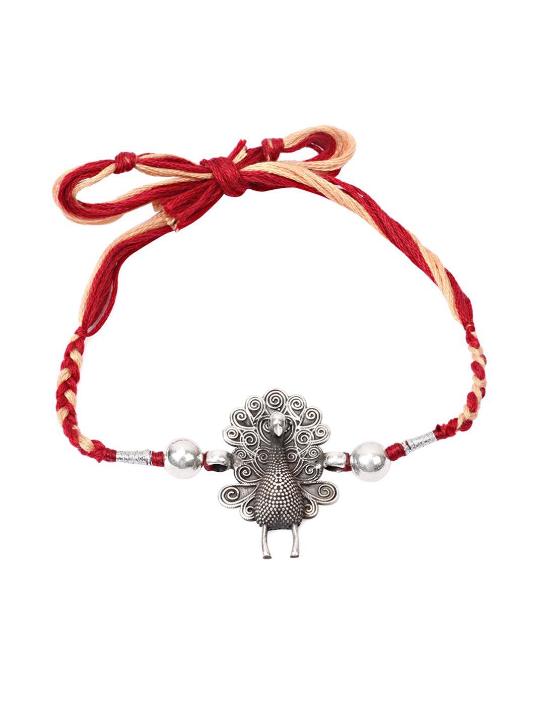 sangeeta boochra red & silver-toned peacock shaped rakhi