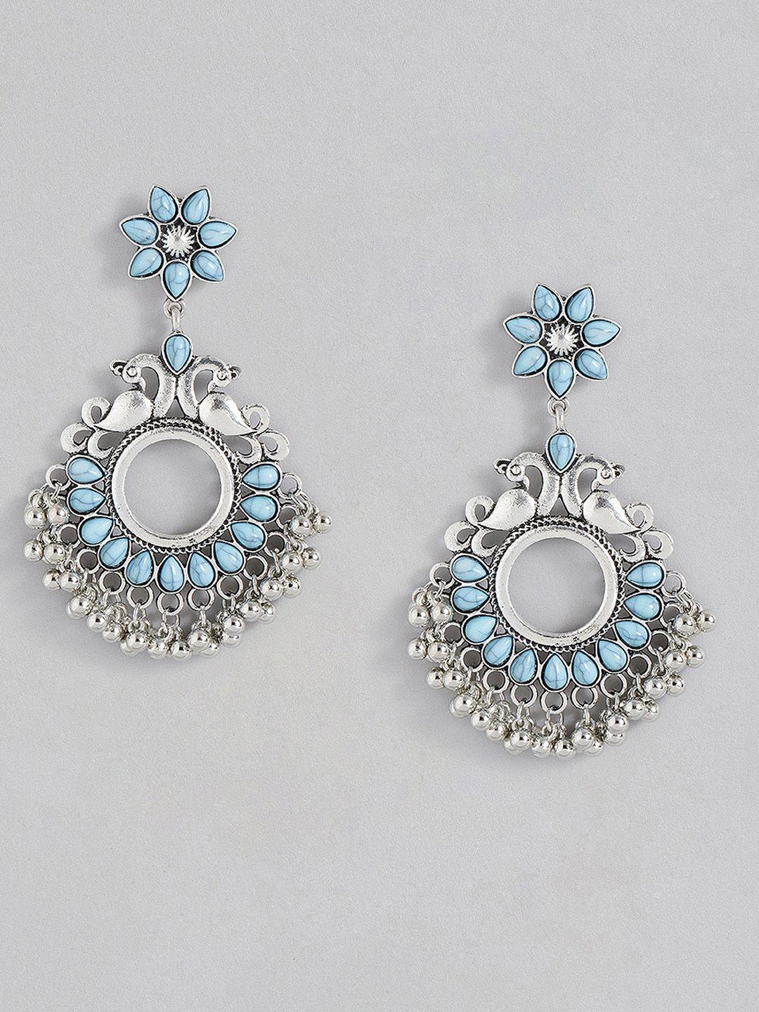 sangria blue & silver-toned peacock shaped drop earrings