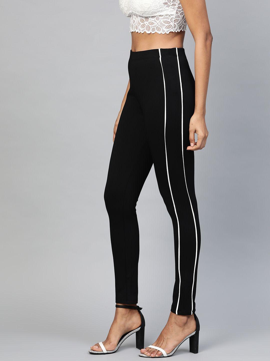 sassafras women black & white slim fit solid side stripe treggings