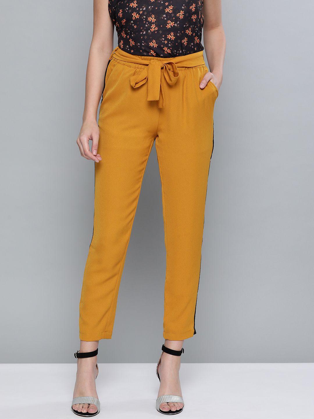 sassafras women mustard yellow tapered fit solid regular trousers