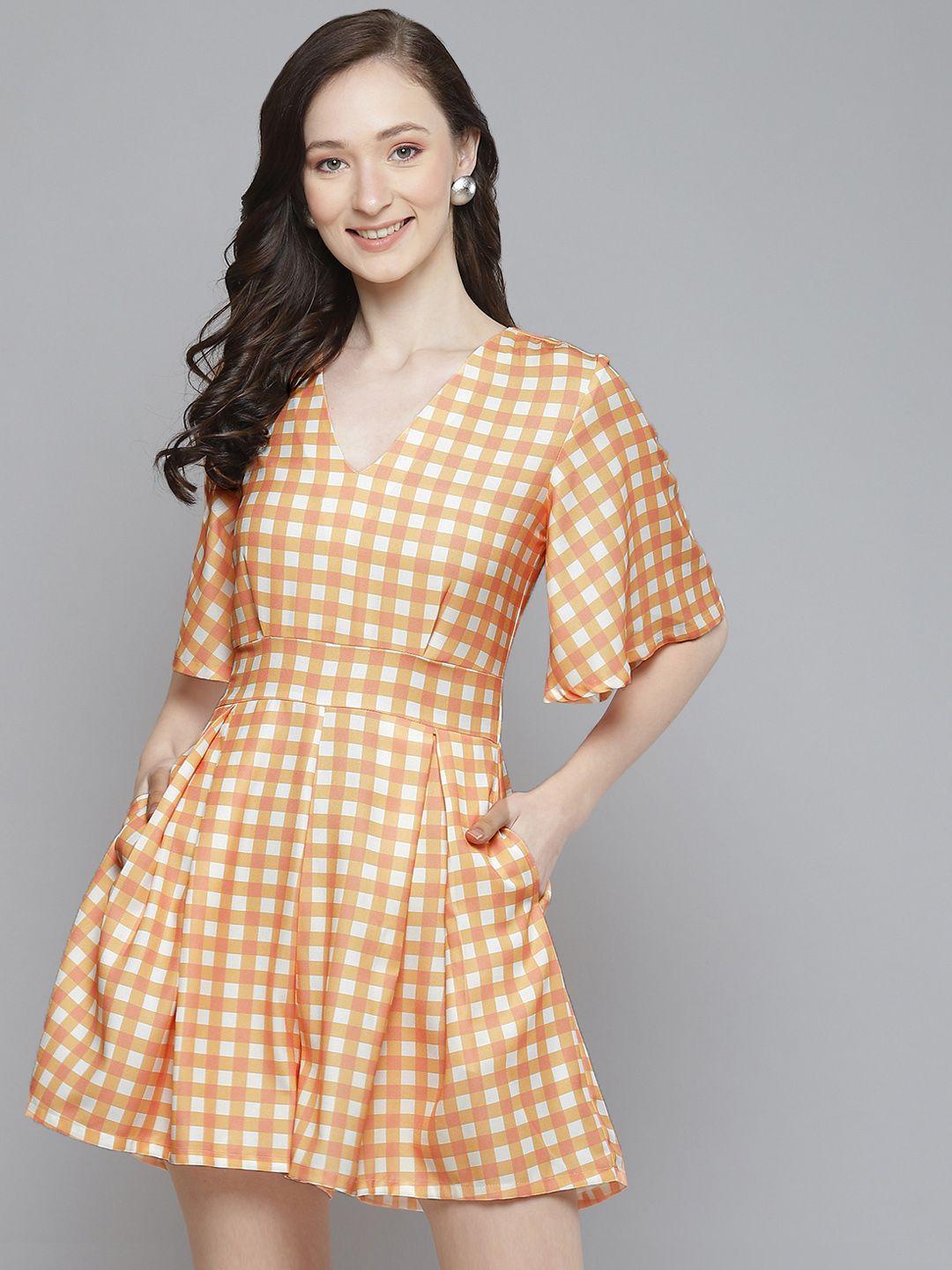 sassafras women peach-coloured & white checked playsuit