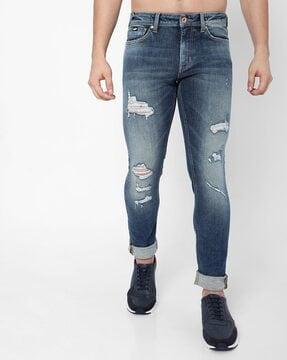 sax distressed mid-rise washed skinny jeans