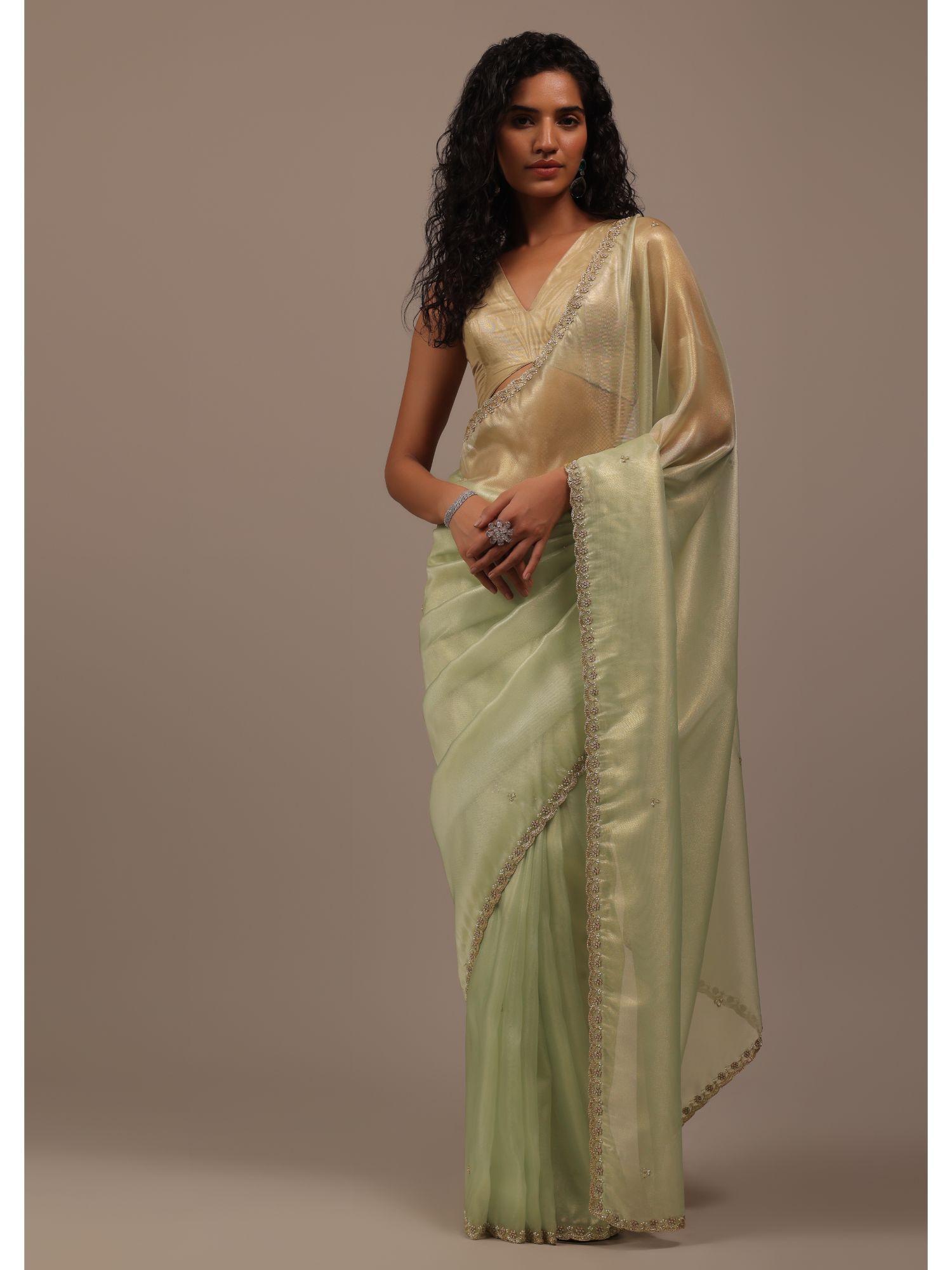 sea green foil saree in tissue with cut dana embroidered borders with unstitched blouse