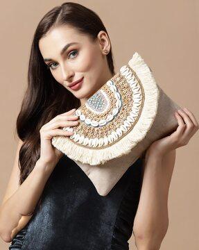 seashell embellished sling bag with fringed detail