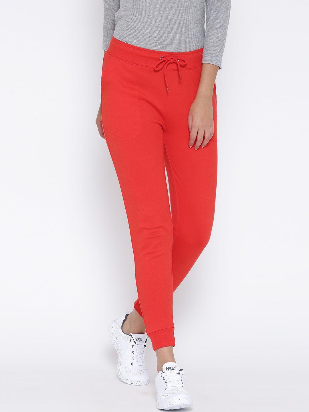 sera coral red cropped track pants with embellished detail