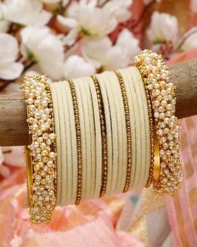 set of 23 stone-clumped bangles