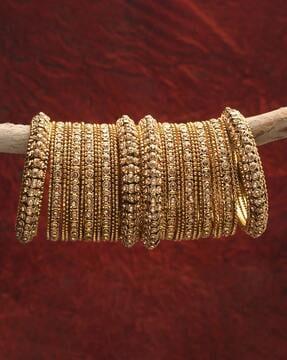 set of 28 gold-plated slip-on bangles