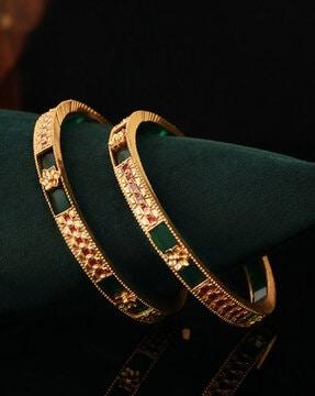 set of 2 gold-plated bangles with floral accent