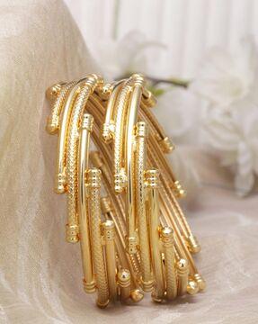 set of 2 gold-plated geometric pattern bangles