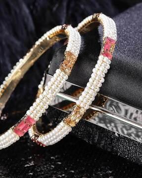 set of 2 gold-plated stone-studded bangles with pearls