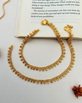 set of 2 women gold-plated american diamond-studded anklets