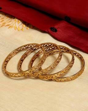 set of 4 gold-plated slip-on bangles