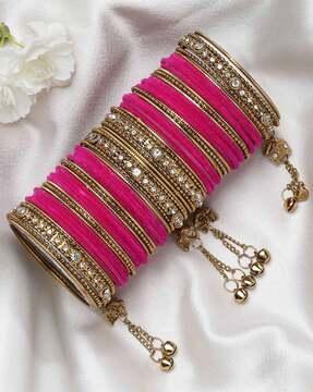 set of 56 gold-plated velvet bangles