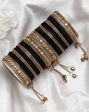 set of 56 gold-plated velvet bangles