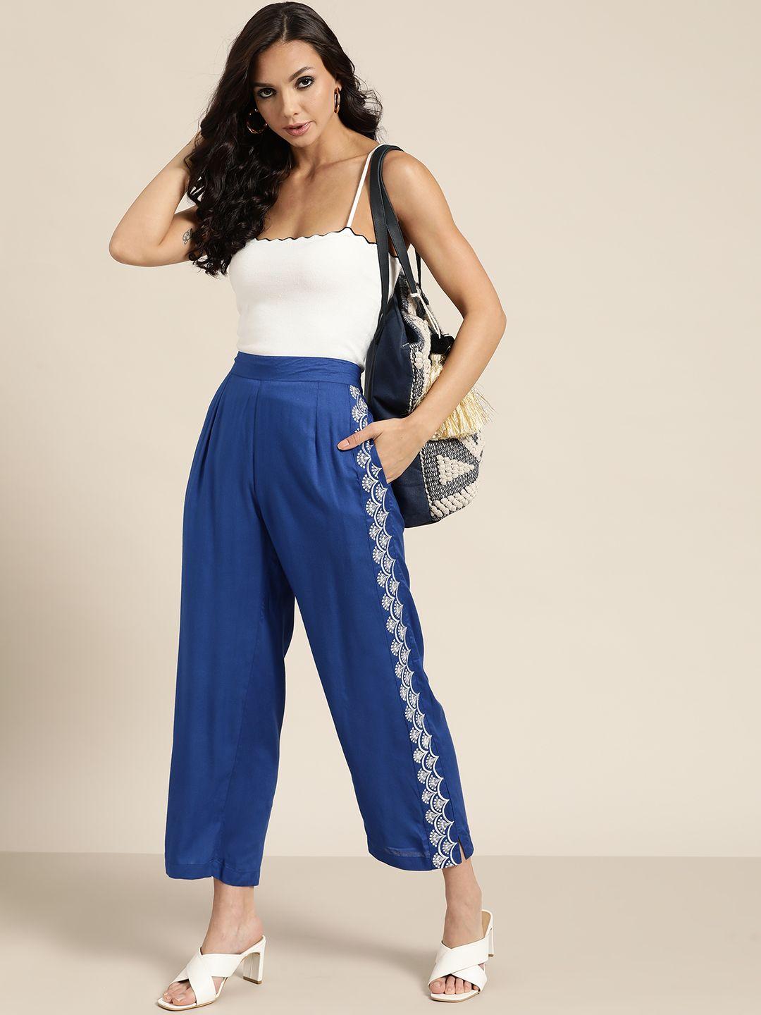 shae by sassafras women blue solid pleated trousers with embroidered detail