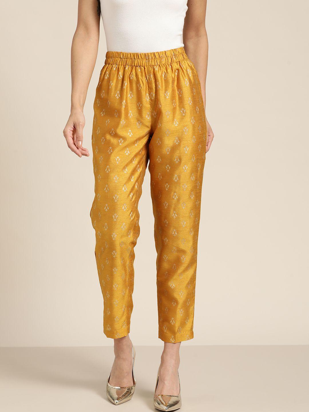 shae by sassafras women mustard yellow & golden ethnic motifs printed pleated trousers