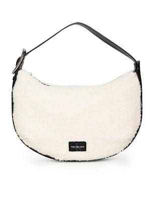 sherpa crescent hand bag