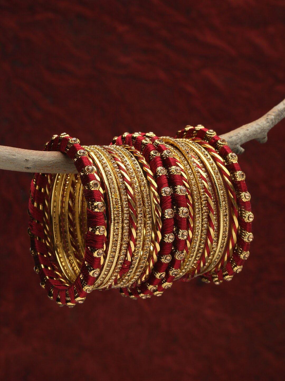 shining diva set of 26 gold plated maroon crystal studded bangle set