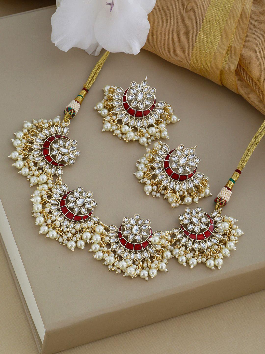 shoshaa gold-plated off-white & red kundan studded & enamelled beaded jewellery set