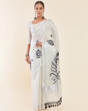 silver tissue kasavu saree with peacock feather embroidery